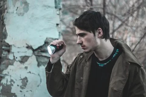 Man with flashlight Stock Photos