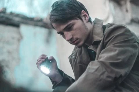 Man with flashlight Stock Photos