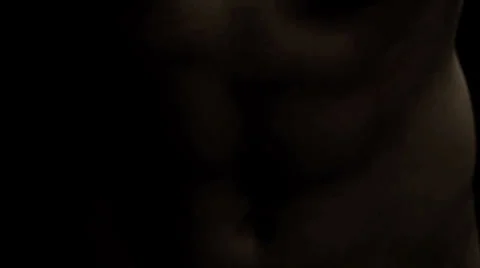 Man flexes and looks up into the camera Stock Footage 33831056