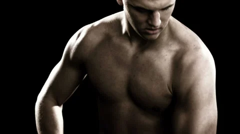 Man flexes both of his biceps Stock Footage 33831048