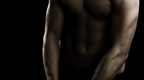 Man flexing his back and arm muscles Stock Footage 33831053