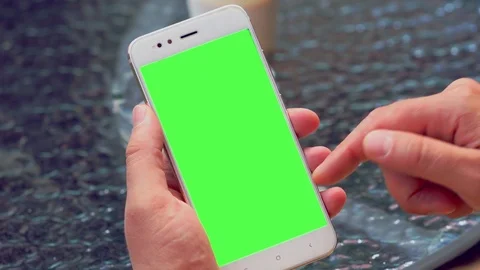 Man flicking through information on his mobile Stock Footage 112154883