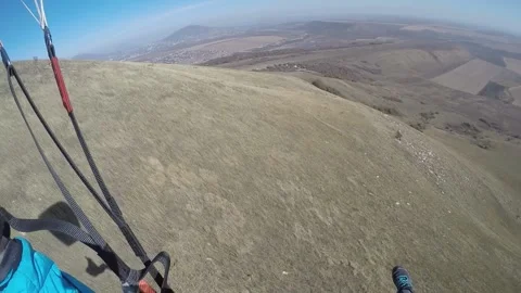 A man flies down a mountain on Speed gliding Stock Footage 195499542