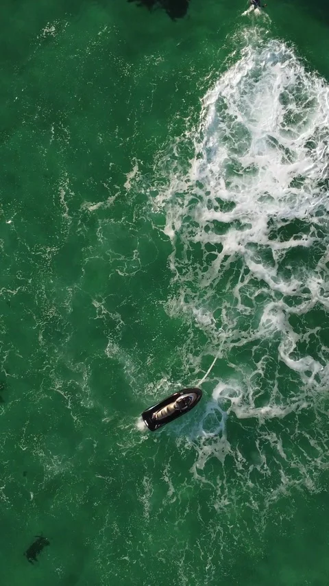 A man flies on a FlyBoard. Aerial top down view. Water extreme sport, azure Stock Footage 274533552
