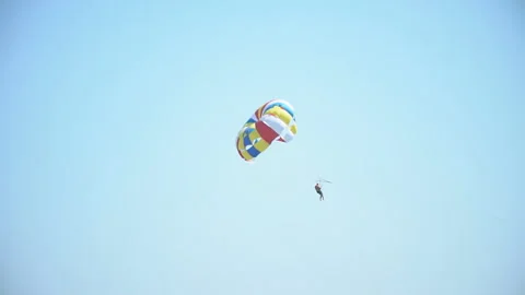 Man flies by parachute Stock Footage 120999751