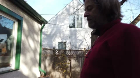 A man flipping hamburgers on his BBQ 4K Stock-Footage 142277553