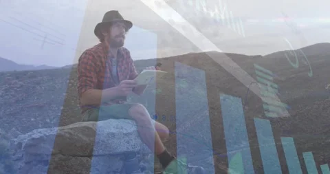 Man flipping pad pages while initiating animated finance charts and down arrow Vídeo Stock 331735835