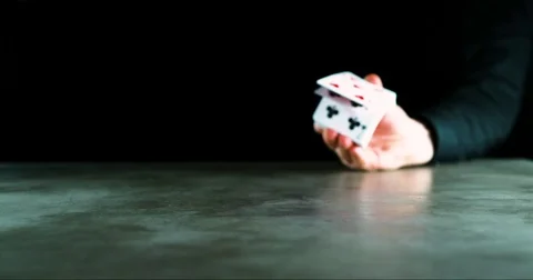 Man flipping stack of cards against black background in slow motion Video stock 71235581