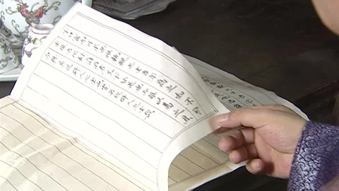 The man is flipping through documents and files Stock Footage 276516757