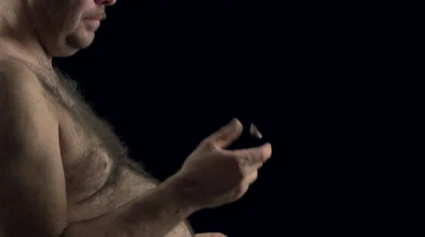 Man flipping a wedding ring in slow motion. Stock Footage 47228023