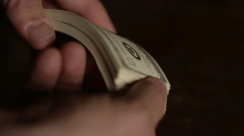 Man flips through hundred dollar bills - American Money Stock Footage 44258938