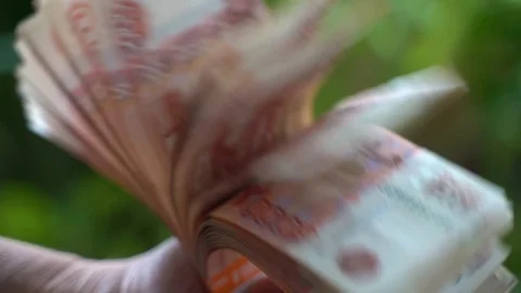 Man flips through money in slow motion Stock Footage 127220638
