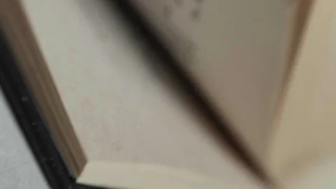A man flips through pages in a book. Slowmotion, 180fps Stock Footage 86283555