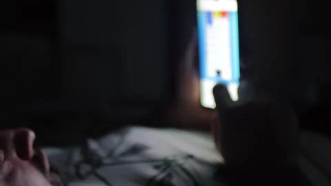 A man flips through the phone tape at night Stock Footage 277409647