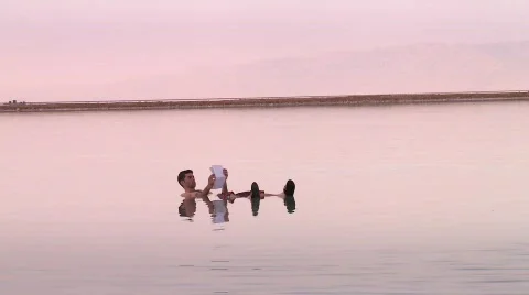 A man floating in the Dead sea 2 Video stock 531776