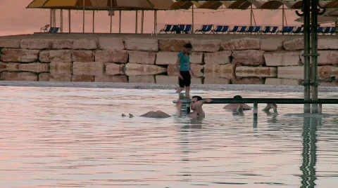 A man floating in the dead sea Stock Footage 534818