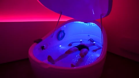 Man Floating in Hyper Saline Float Pod Timelapse Stock Footage 334359799