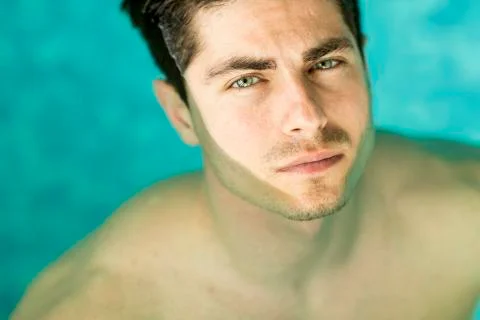 Man floating in the pool Stock Photos