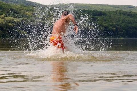 Man floating in the river Stock Photos
