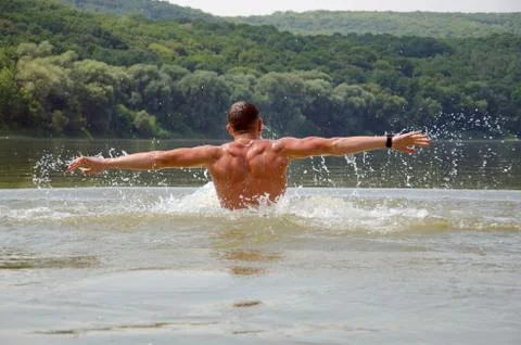Man floating in the river Stock Photos