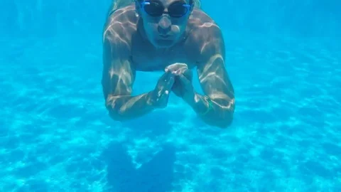 The man is floating under the water. Stock Footage