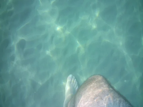 A man floating under the water Stock Footage 80150392