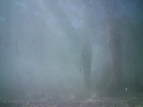 A man floating under the water Stock Footage 80150695