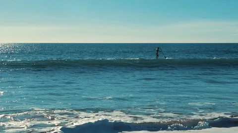 A man floats along the ocean Stock Footage 86189588