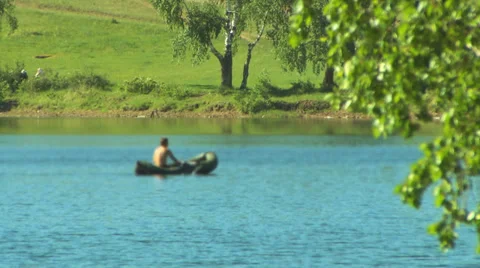 Man floats by on boat Video stock 33858570