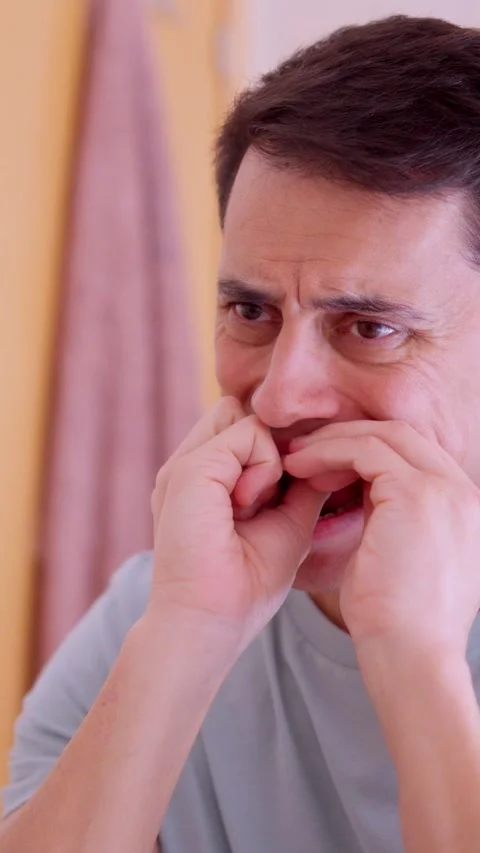 Man flossing teeth in bathroom mirror Stock Footage 306569508