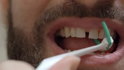 Man Flossing Teeth with Floss Pick Holder Tool Stock Footage 306385281