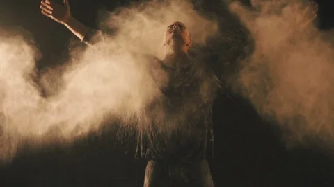 Man in flour particles Stock Footage 106787410