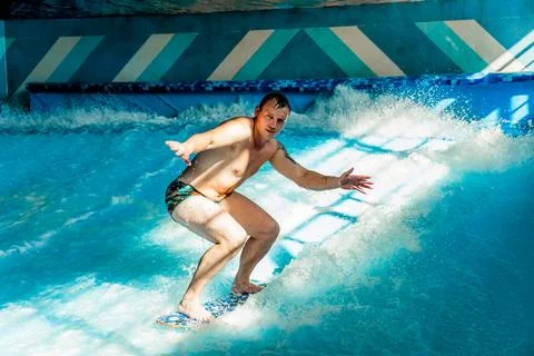 Man on flowboard on blue background Stock Photos