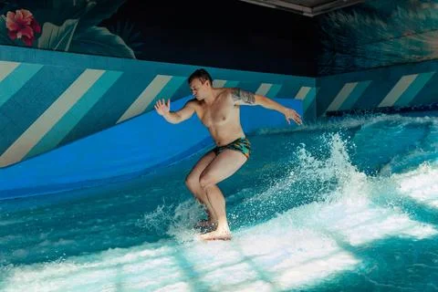 Man on flowboard on blue background Stock Photos