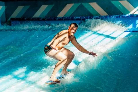 Man on flowboard on blue background Stock Photos
