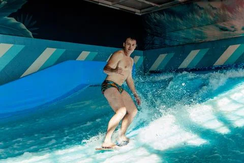 Man on flowboard on blue background Stock Photos