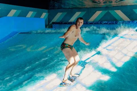 Man on flowboard on blue background Stock Photos