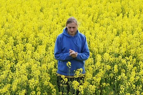Man in flower meadow Stock Photos