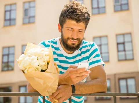 Man with flowers Stock Photos