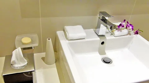 Man flushing water in the sink Stock Footage 46926168