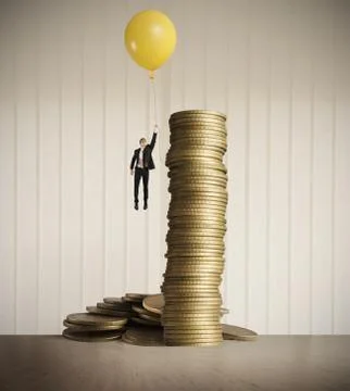 Man flying with balloon Stock Photos
