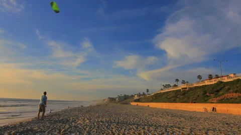 Man Flying Kite on the Beach  Stock Footage 1550074