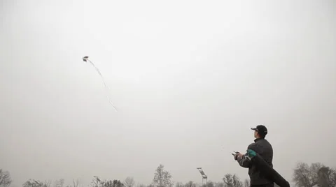 Man flying kite in park, China. Stock Footage 34376085