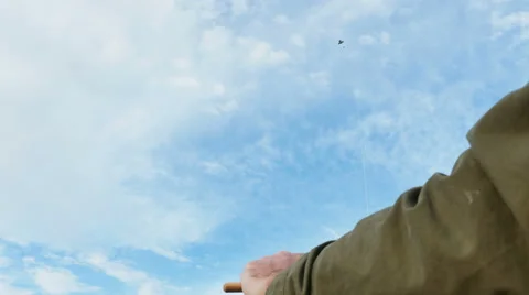 Man Flying a Kite View from String to Kite Blue Skies, 4K Stock Footage 61447244