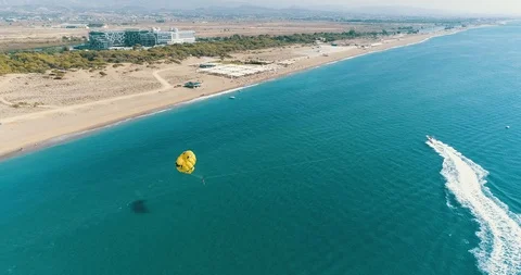 Man is flying on a paraglider on the sea Stock Footage 101264283