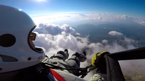 Man flying on paraplane in sky, clouds and skyline landscape. Point of view Stock Footage 98167031