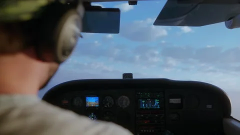 Man flying a small Cessna airplane during the sunrise. Stock Footage 164320073