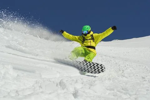 Man flying on snowboard Fotos de archivo