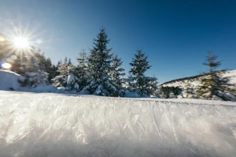 A man flying through the air while riding a snow board Stock Photos
