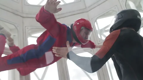 Man flying in a wind tunnel Stockbeeldmateriaal 64206443